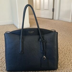 Navy blue Kate Spade purse. It is a few years old, but barely used.